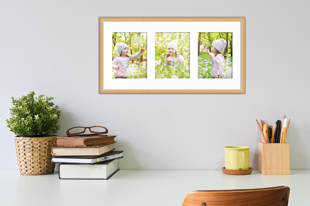 kreative Zeit mit Kindern - Lieblingsfotos zusammenstellen Büro dekoriert mit Kinderfotos in naturfarbenen Galerierahmen