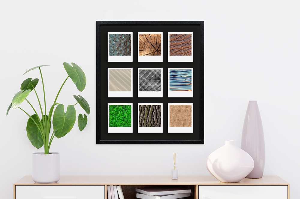 schwarzer Polaroid Rahmen für neun Bilder modern eingerichteter Arbeitsplatz dekoriert mit schwarzem 9-fach Fotorahmen