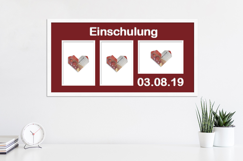 Geschenkidee zur Einschulung: personalisiertes Geldgeschenk gefaltetes Geldgeschenk in weißem Bilderrahmen mit rotem Passepartout