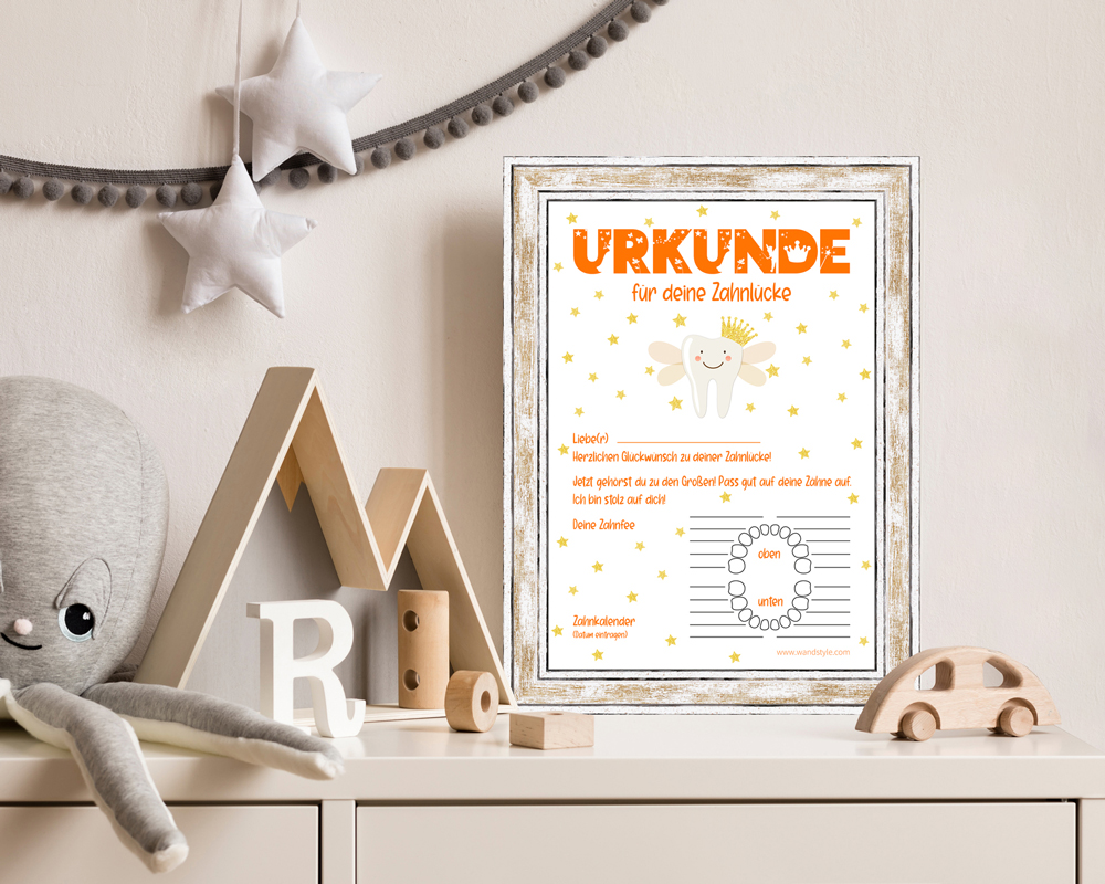 Urkunde für Zahnlücke auf Schrank in modernem Kinderzimmer dekoriertes Kinderzimmer  mit eingerahmter Urkunde von der Zahnfee