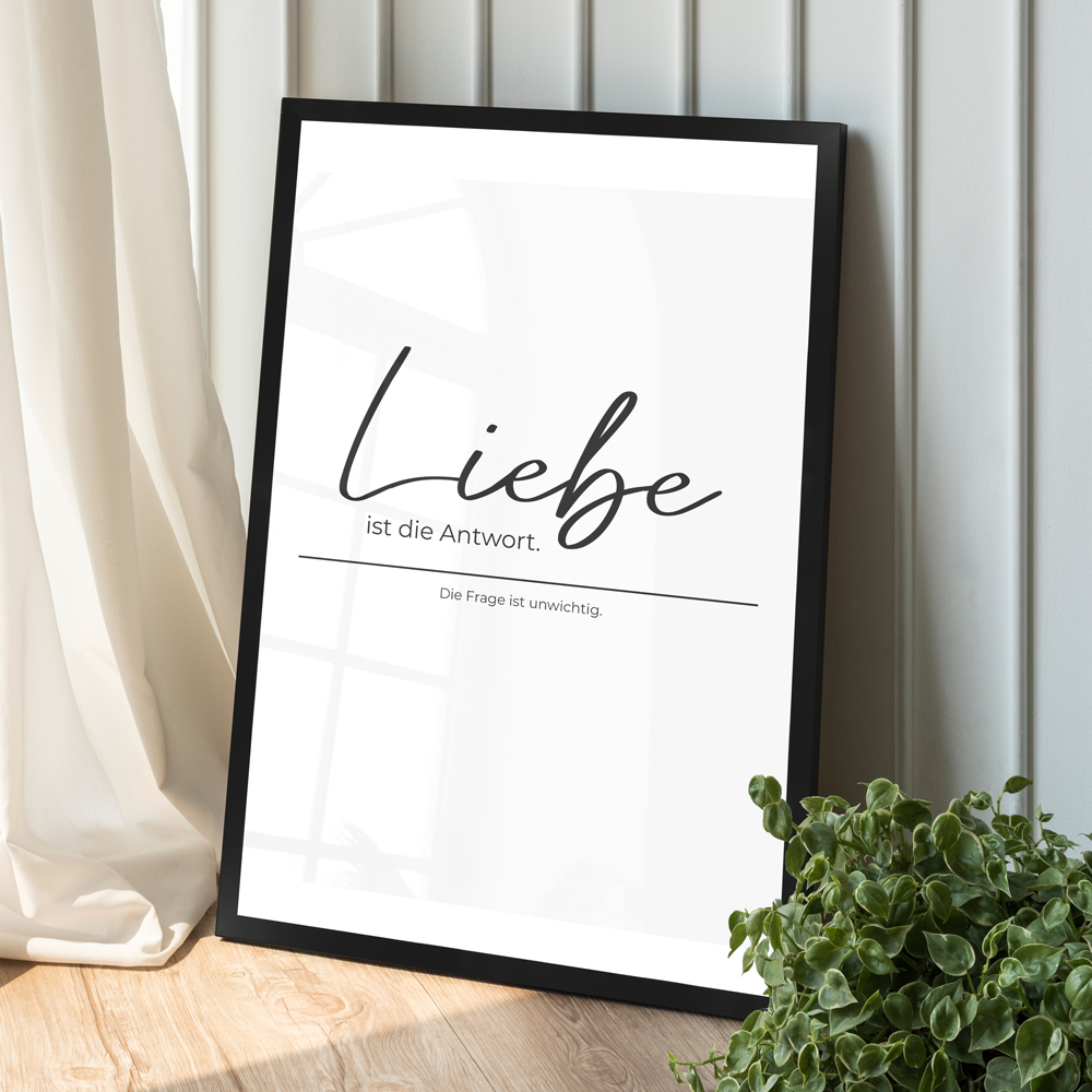 Dekoration weißes Poster "Liebe ist die Antwort" in schwarzem Holzrahmen